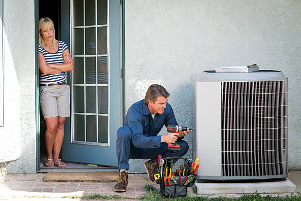 Air duct cleaning professional at work